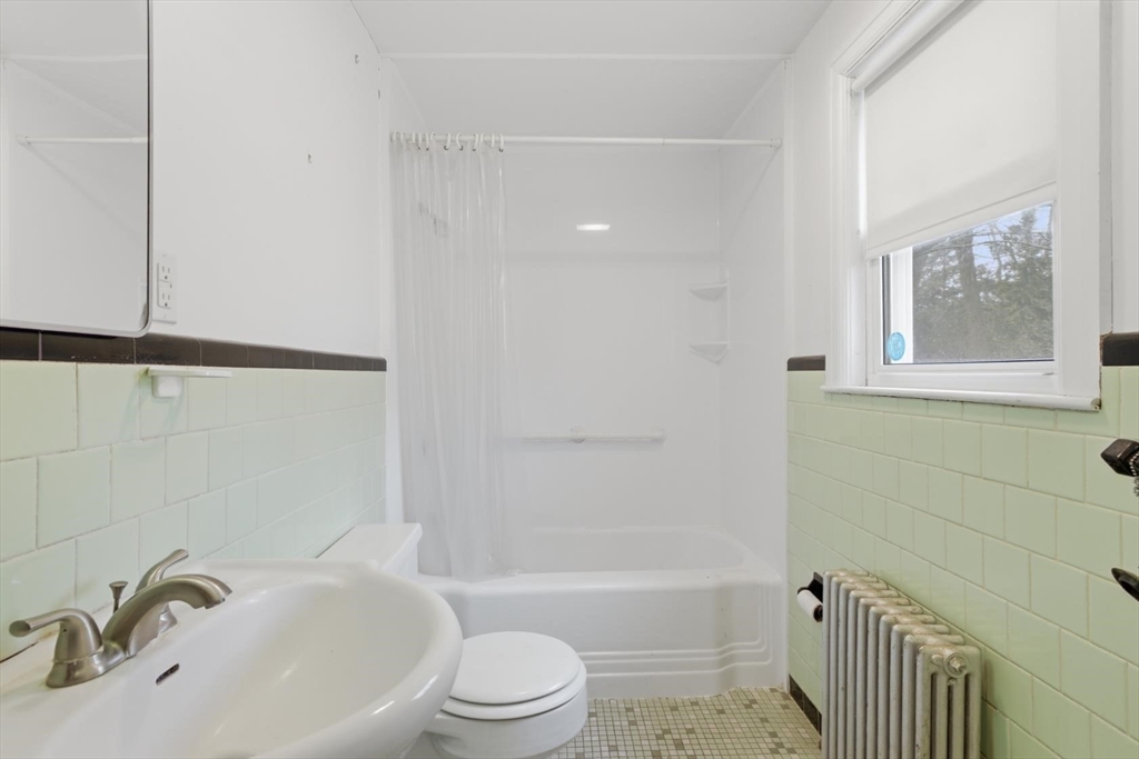 11 Clark Avenue Walpole, MA 02081 - Photo 16 of 25 a bathroom with a sink toilet and shower
