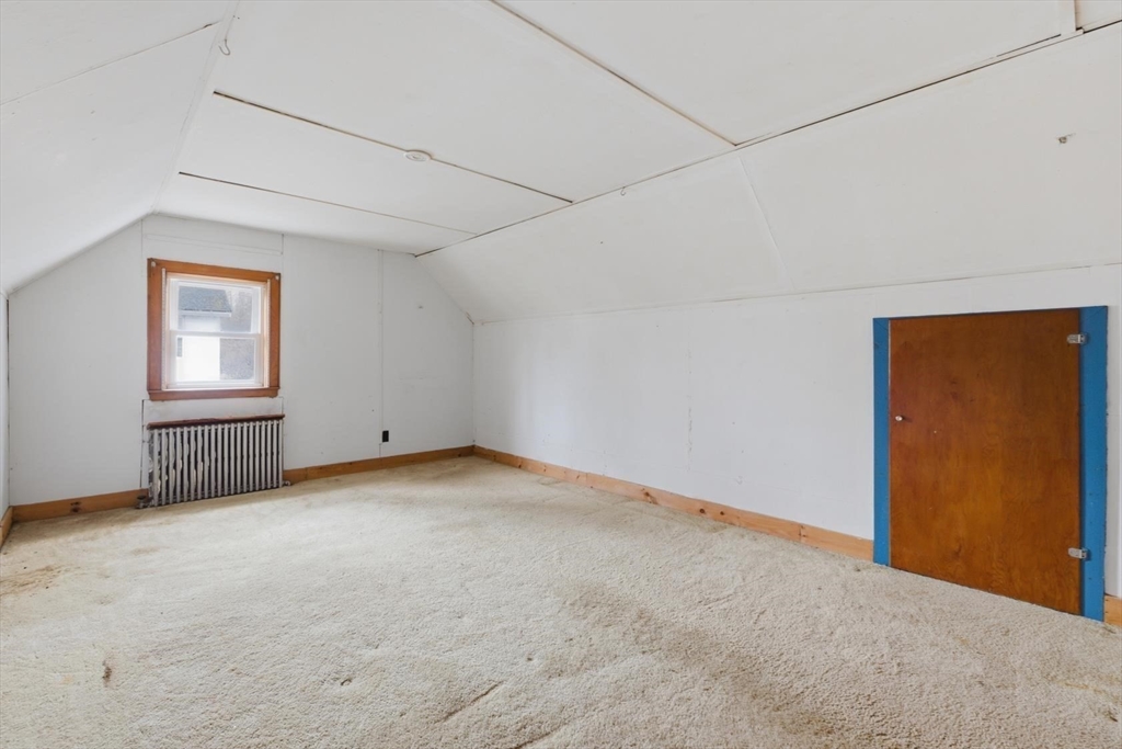 11 Clark Avenue Walpole, MA 02081 - Photo 18 of 25 a view of an empty room with a window