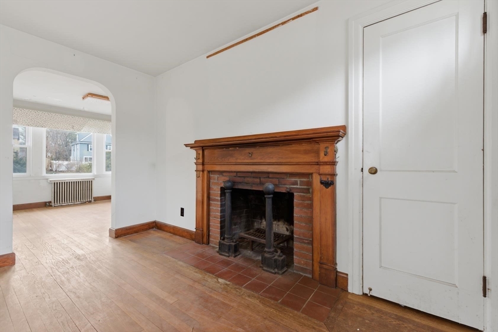 11 Clark Avenue Walpole, MA 02081 - Photo 9 of 25 a living room with furniture and a fireplace