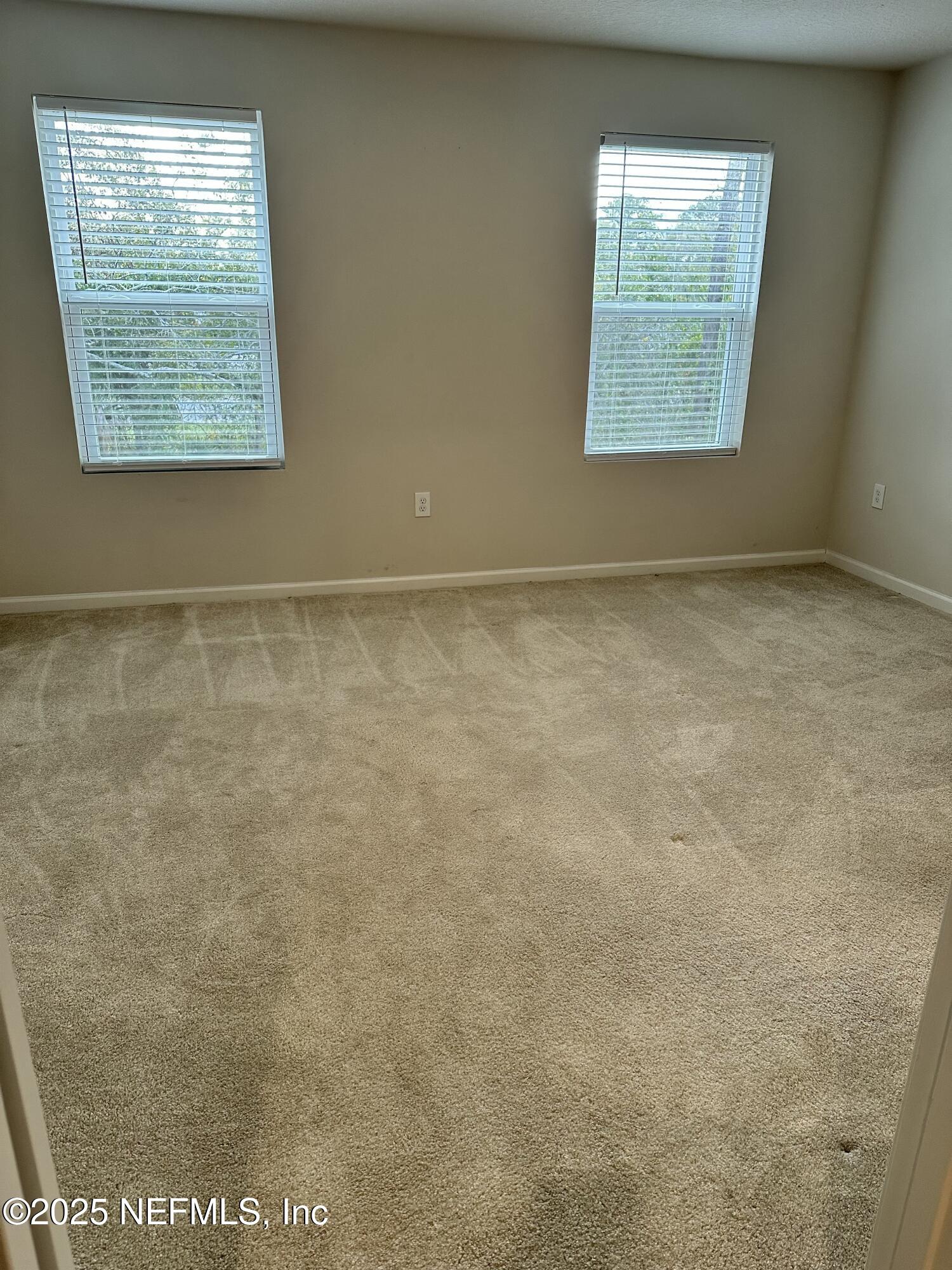 2548 Sadler Trce Way Jacksonville, FL 32210 - Photo 3 of 12 an empty room with a window