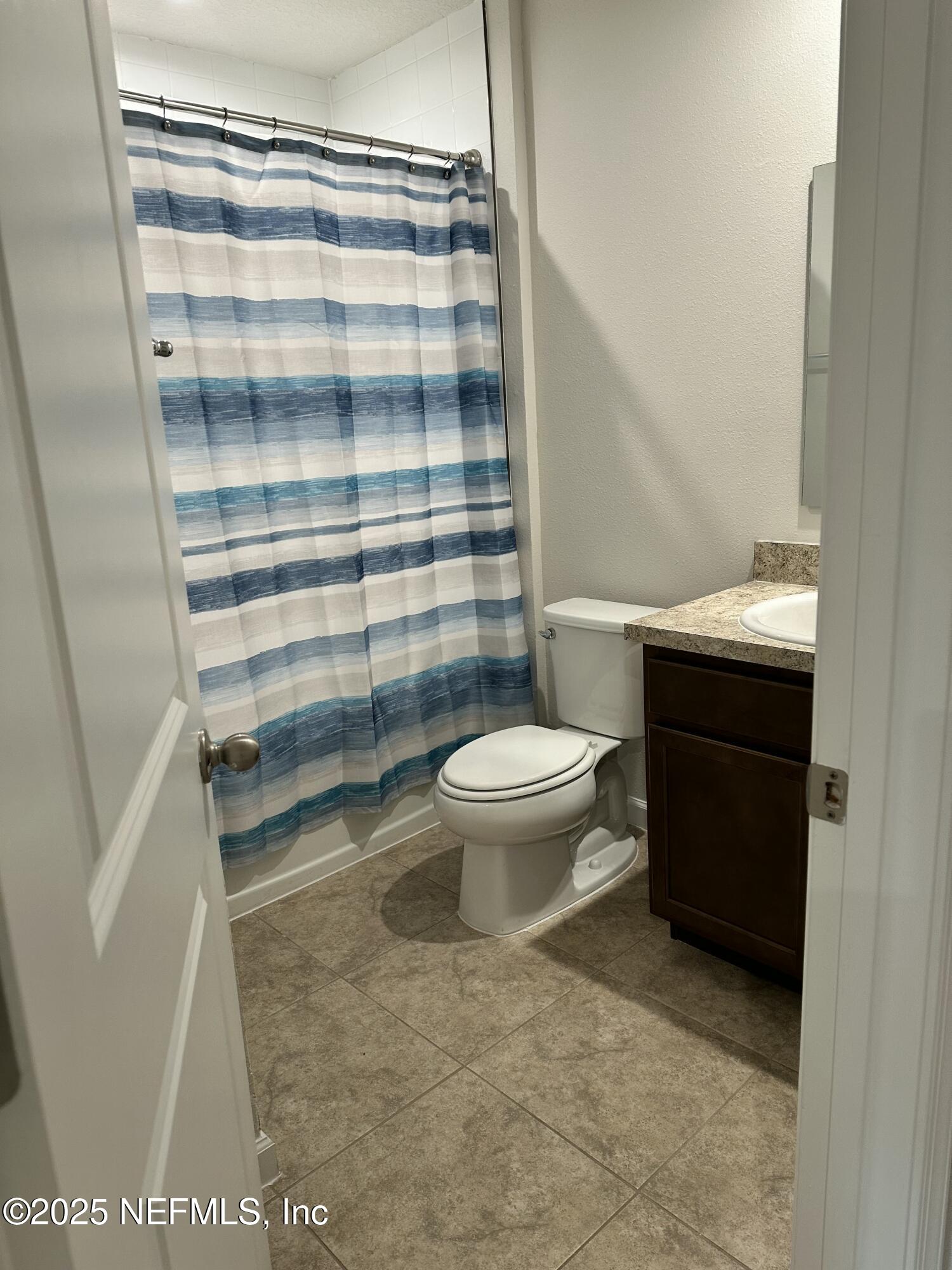 2548 Sadler Trce Way Jacksonville, FL 32210 - Photo 5 of 12 a bathroom with a sink toilet and shower