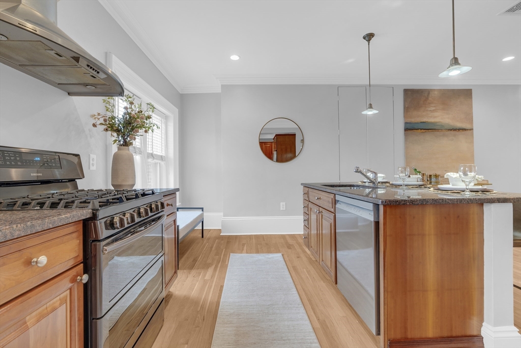 69 Rutland Street, Unit 3 Boston, MA 02118 - Photo 13 of 39 a kitchen with stainless steel appliances granite countertop a stove a sink and a refrigerator