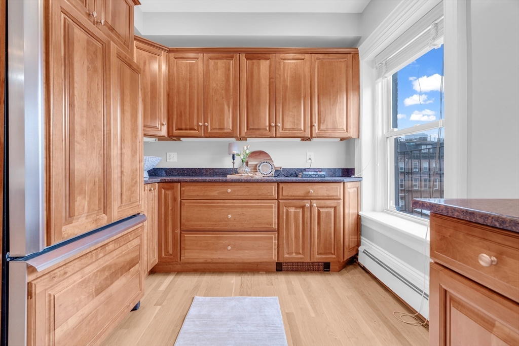 69 Rutland Street, Unit 3 Boston, MA 02118 - Photo 14 of 39 a kitchen with granite countertop a sink and a stove