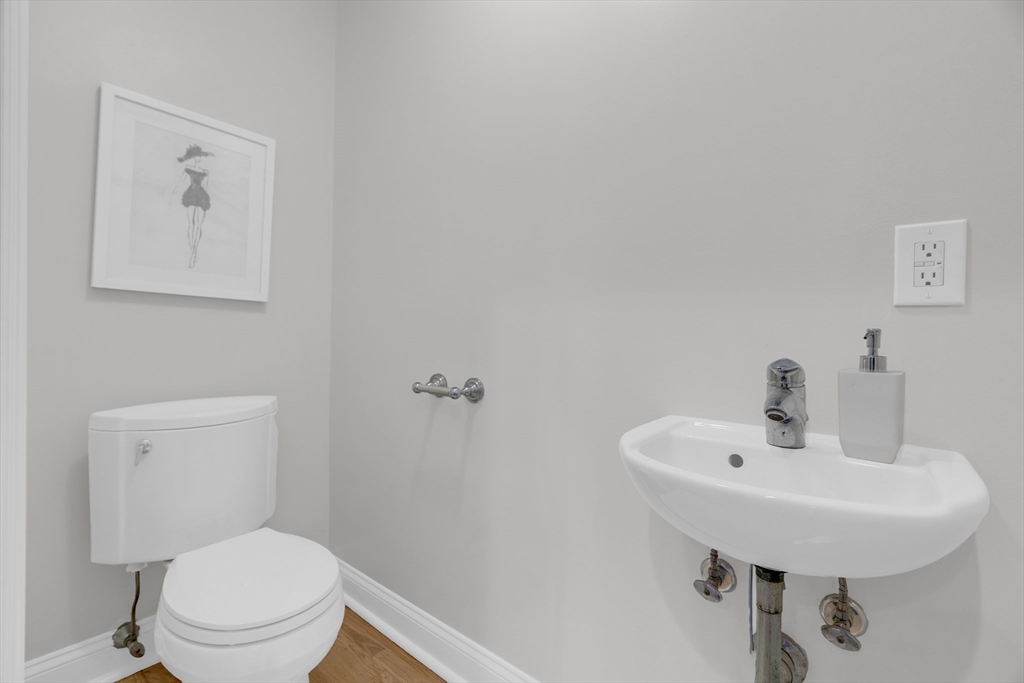 69 Rutland Street, Unit 3 Boston, MA 02118 - Photo 17 of 39 a bathroom with a toilet a sink and mirror