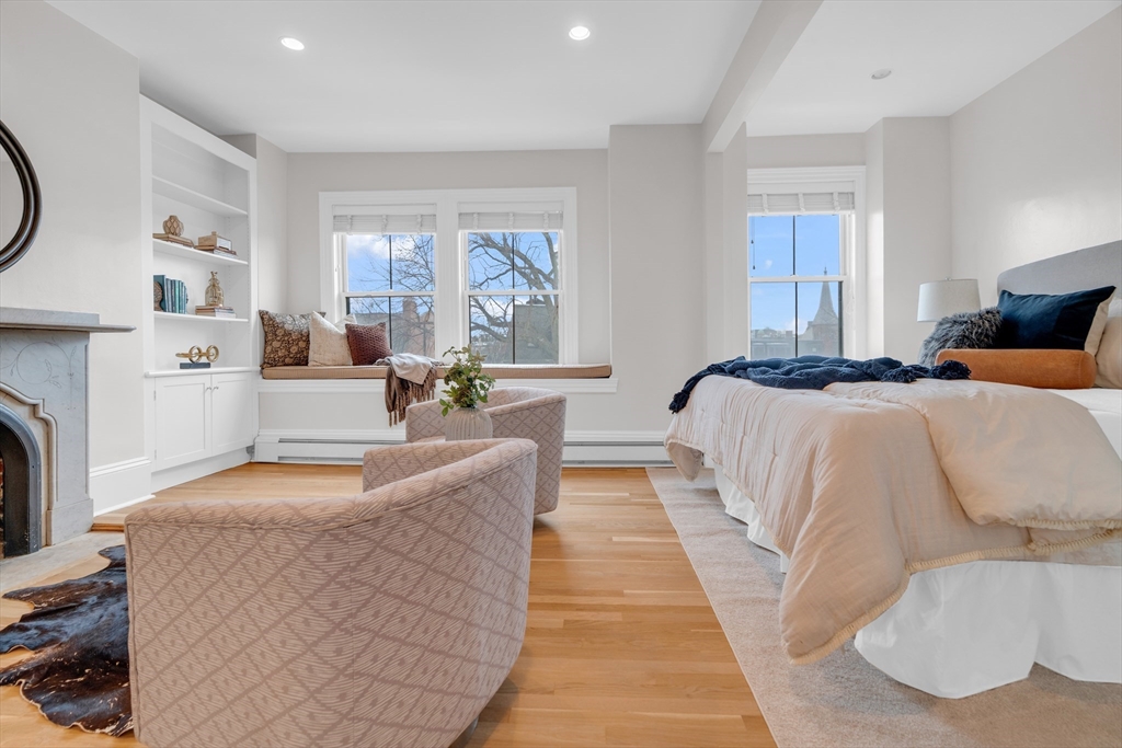 69 Rutland Street, Unit 3 Boston, MA 02118 - Photo 25 of 39 a living room with furniture a fireplace and a large window