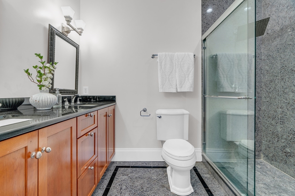 69 Rutland Street, Unit 3 Boston, MA 02118 - Photo 27 of 39 a bathroom with a toilet a sink and mirror