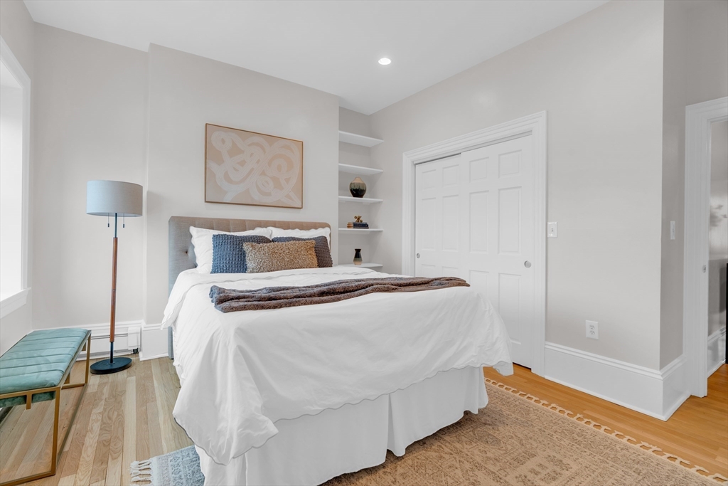 69 Rutland Street, Unit 3 Boston, MA 02118 - Photo 34 of 39 a bedroom with a bed and a lamp