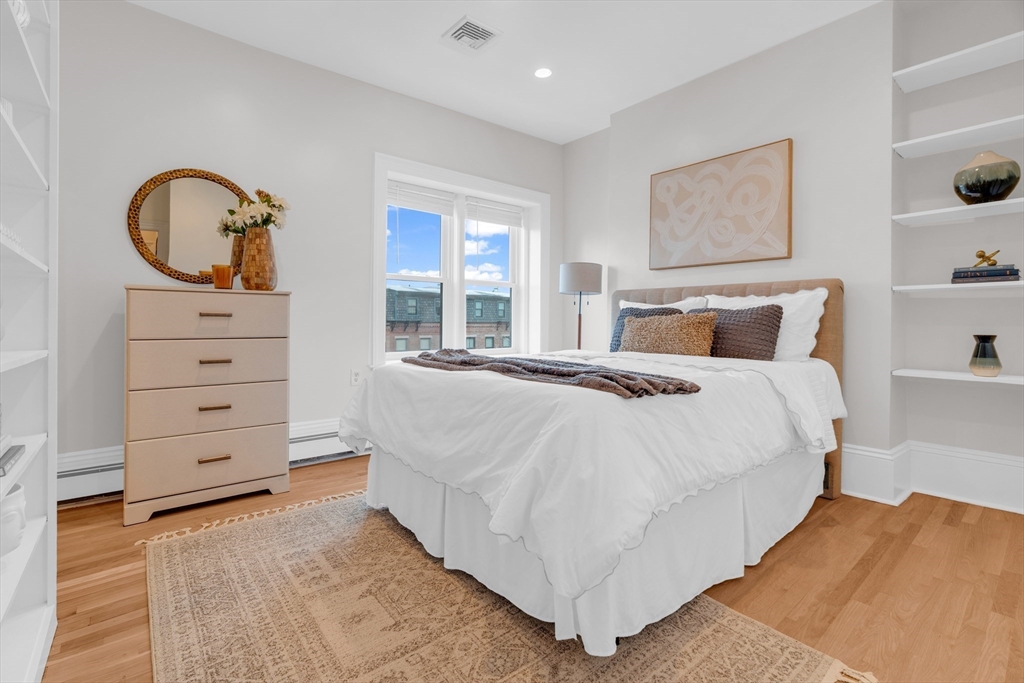 69 Rutland Street, Unit 3 Boston, MA 02118 - Photo 35 of 39 a bedroom with a bed and a dresser