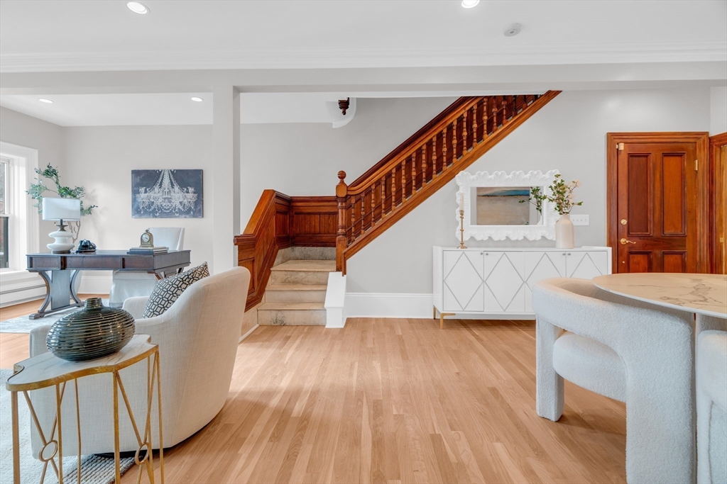 69 Rutland Street, Unit 3 Boston, MA 02118 - Photo 10 of 39 a living room with couches and dining table with wooden floor