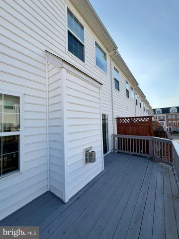 a view of a deck with wooden floor and seating space