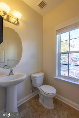 a view of livingroom with furniture a fireplace and wooden floor