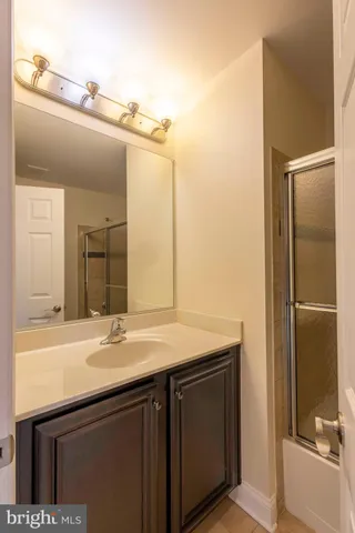 a white toilet sitting next to a bath tub and a shower