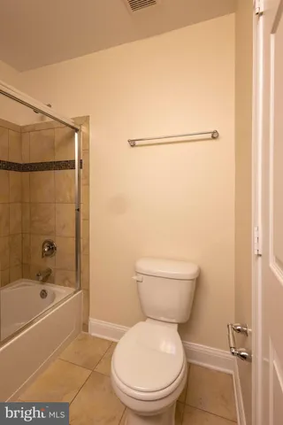 an empty room with a empty space and windows