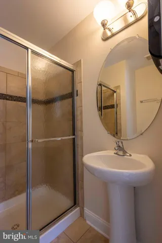 a bathroom with a sink and mirror
