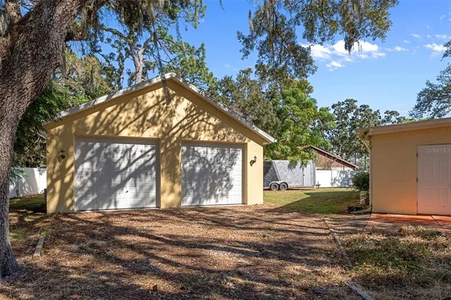 a view of tree in front of a house