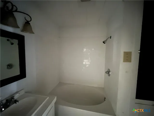 a bathroom with a sink and a tub