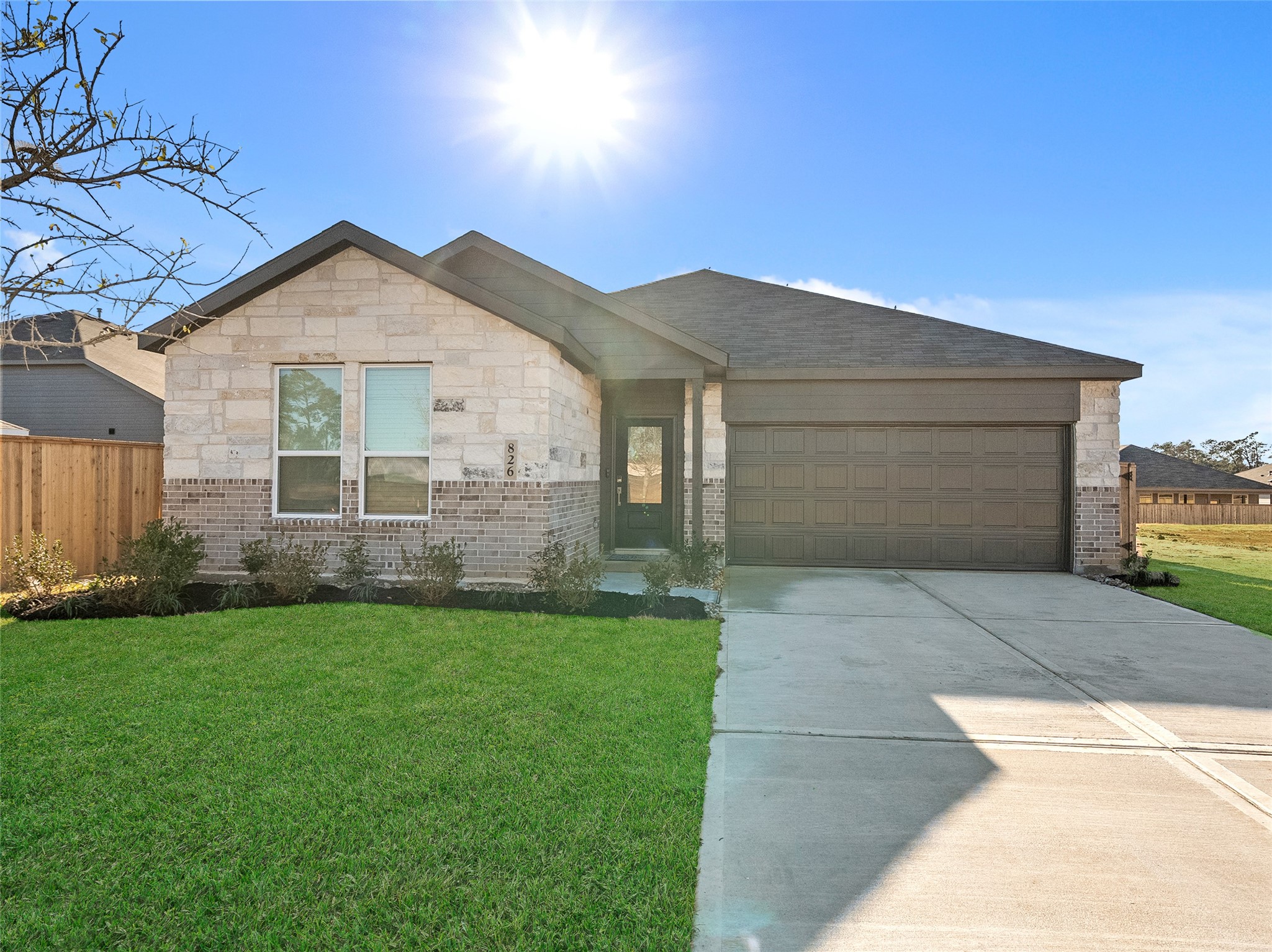 826 Ridgewood Cliffs Willis, TX 77378 - Photo 1 of 26 a front view of a house with a yard