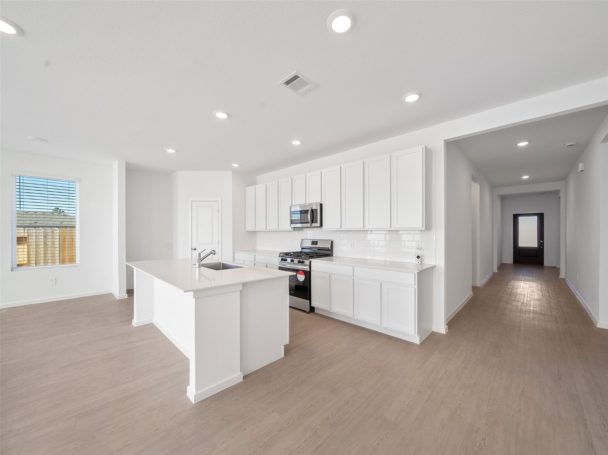 826 Ridgewood Cliffs Willis, TX 77378 - Photo 15 of 26 a view of kitchen center island with white cabinets