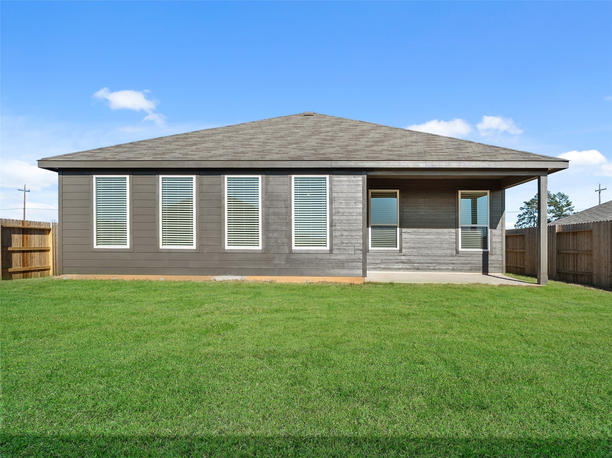 826 Ridgewood Cliffs Willis, TX 77378 - Photo 23 of 26 a front view of a house with yard