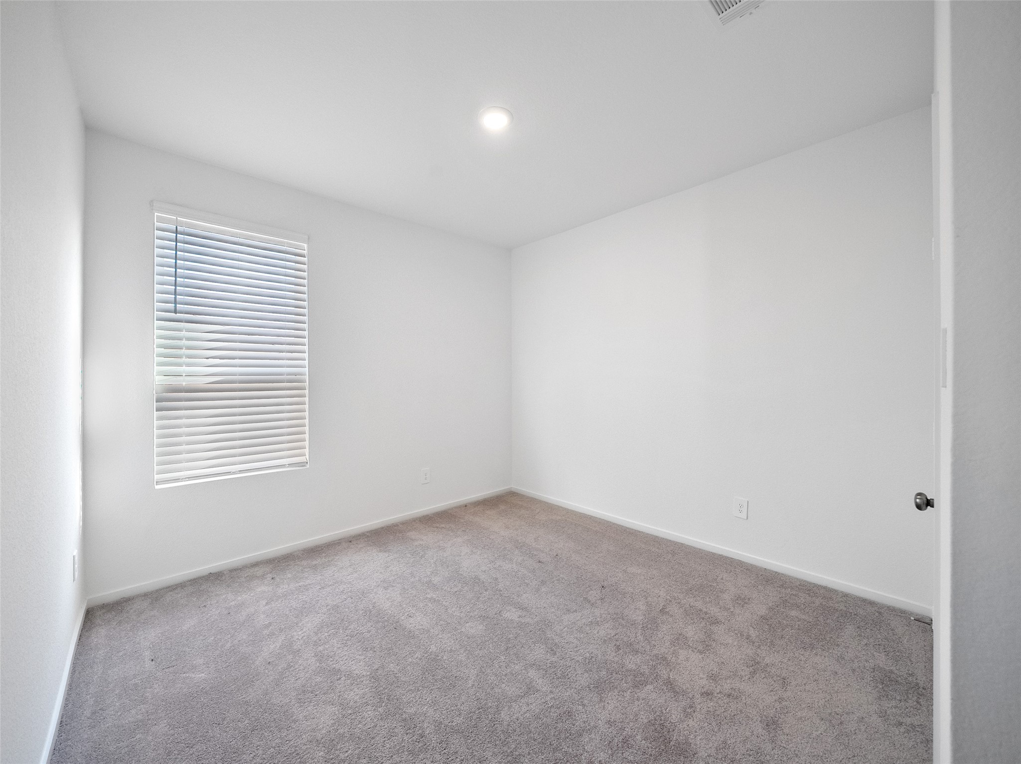 826 Ridgewood Cliffs Willis, TX 77378 - Photo 5 of 26 a view of an empty room with a window