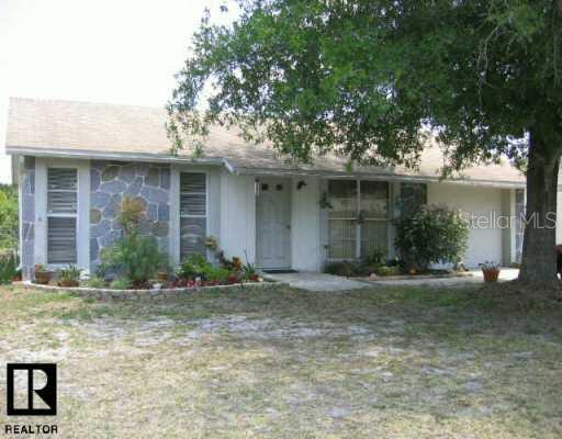 7419 Jenner Avenue New Port Richey, FL 34655 - Photo 1 of 1 Exterior Front - LARGE TREE IN FRONT YARD KEEPS HOUSE COOL AND ELECTRIC BILL LOW.