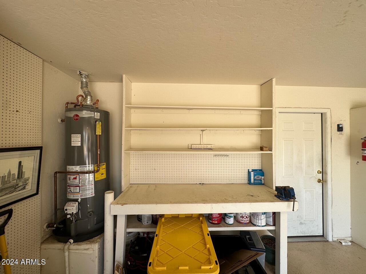 3202 East Decatur Street Mesa, AZ 85213 - Photo 40 of 51 Workbench and gas water heater