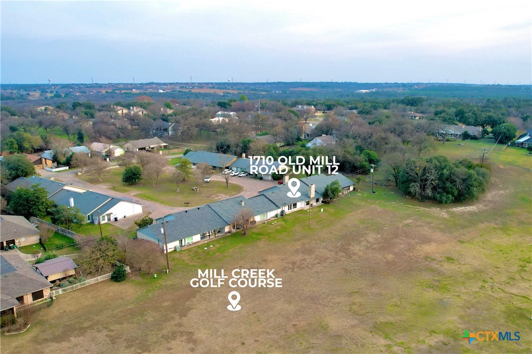 1710 Old Mill Road, Unit 12 Salado, TX 76571 - Photo 40 of 42 an aerial view of residential houses with outdoor space