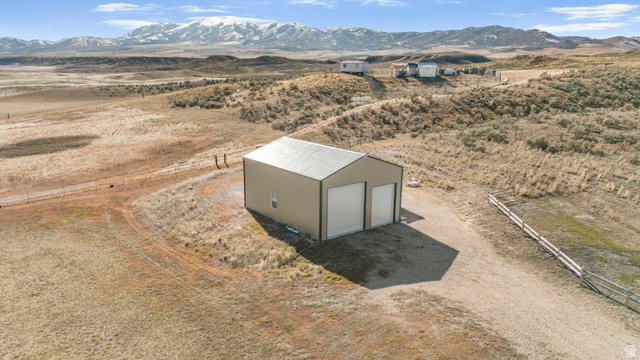 18573 South Marsh Valley Road Downey, ID 83234 - Photo 27 of 32 Aerial view of sparsely populated area featuring a mountainous background and a desert landscape