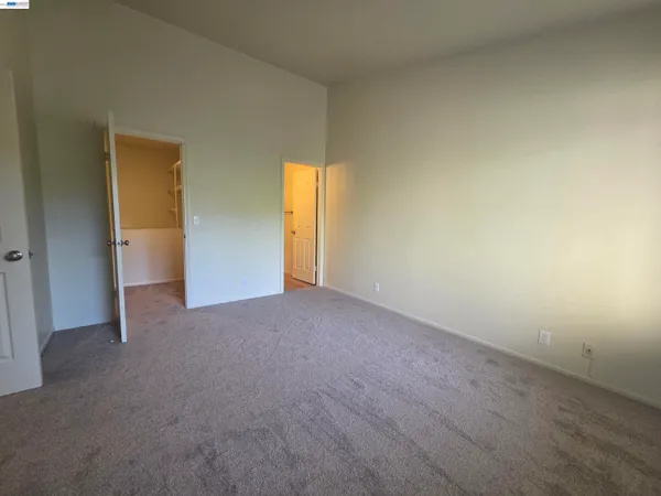 a view of a room with closet and wooden floor
