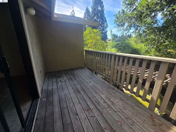 a view of wooden balcony with a swing