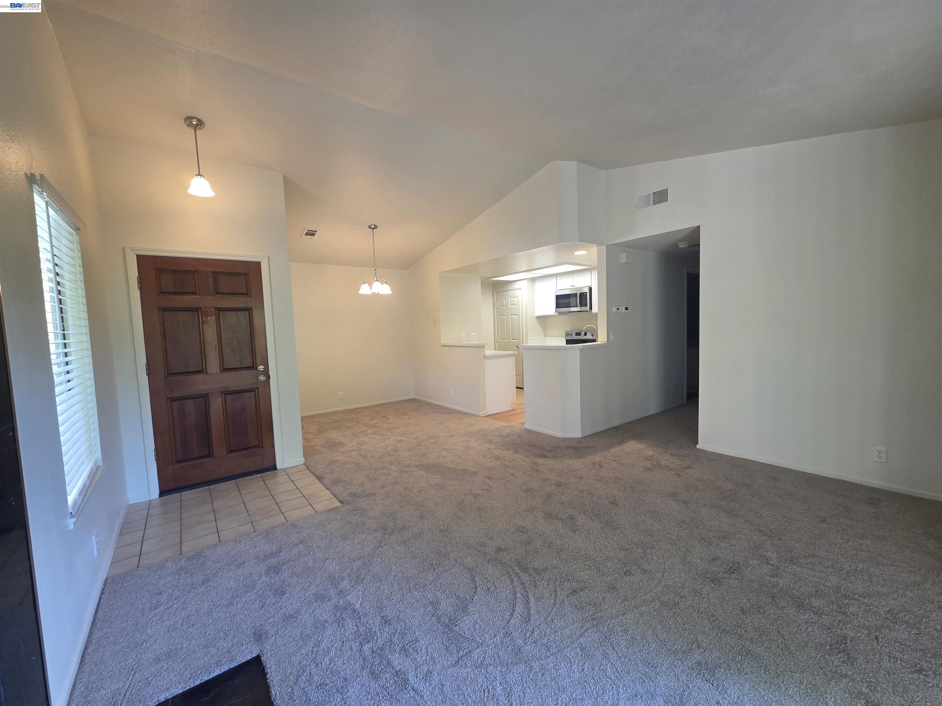 San Ramon San Ramon, CA 94582 - Photo 3 of 30 a view of a kitchen with a sink and a refrigerator