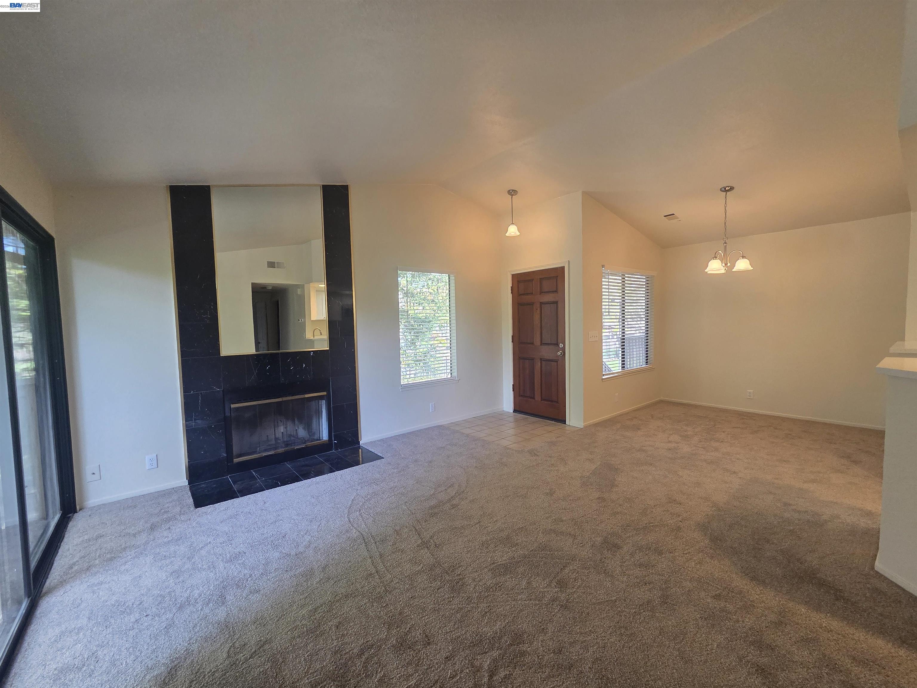 San Ramon San Ramon, CA 94582 - Photo 4 of 30 a view of an empty room with a fireplace and a window