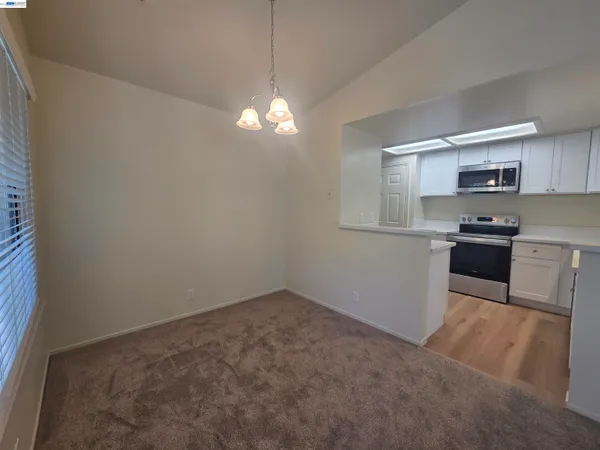 a kitchen with a cabinets and window
