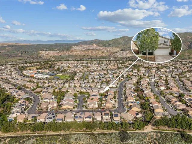 an aerial view of a house with a ocean view