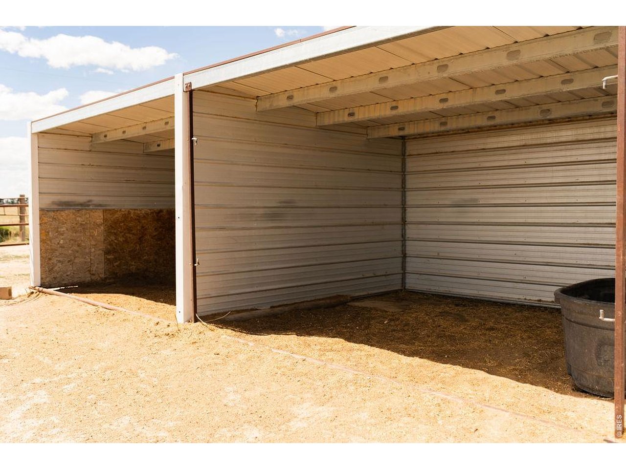 218 Pershing Street Grover, CO 80729 - Photo 4 of 50 10.5+/- Acres Fenced with Continuous Pipe and Metal Loafing Sheds and Tack Room