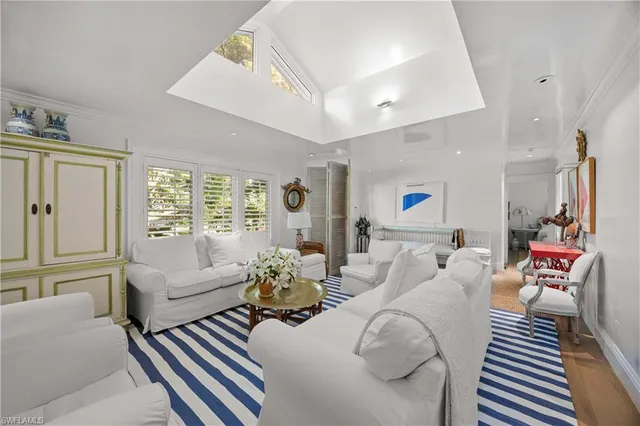 a kitchen with kitchen island a stove and a sink