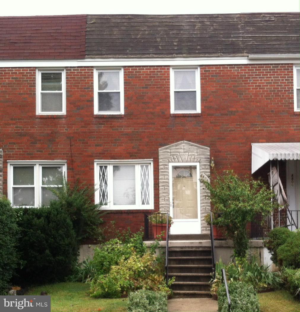 4804 Greencrest Road Baltimore, MD 21206 - Photo 1 of 3 a front view of a house with a yard