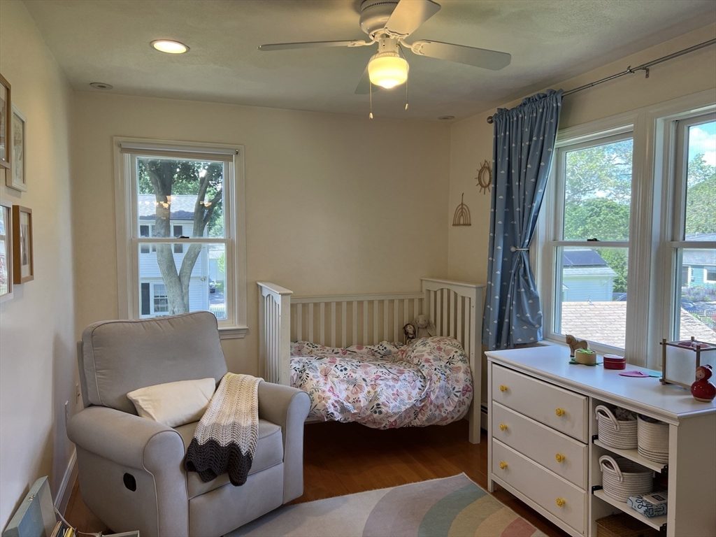 11 Garrison Road, Unit 1 Arlington, MA 02474 - Photo 34 of 42 a bedroom with furniture and windows