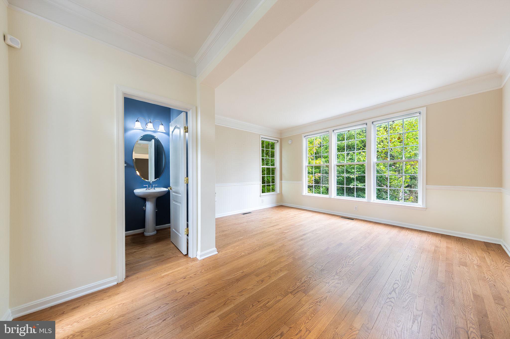 21934 Windover Drive Broadlands, VA 20148 - Photo 13 of 54 wooden floor in an empty room with a window