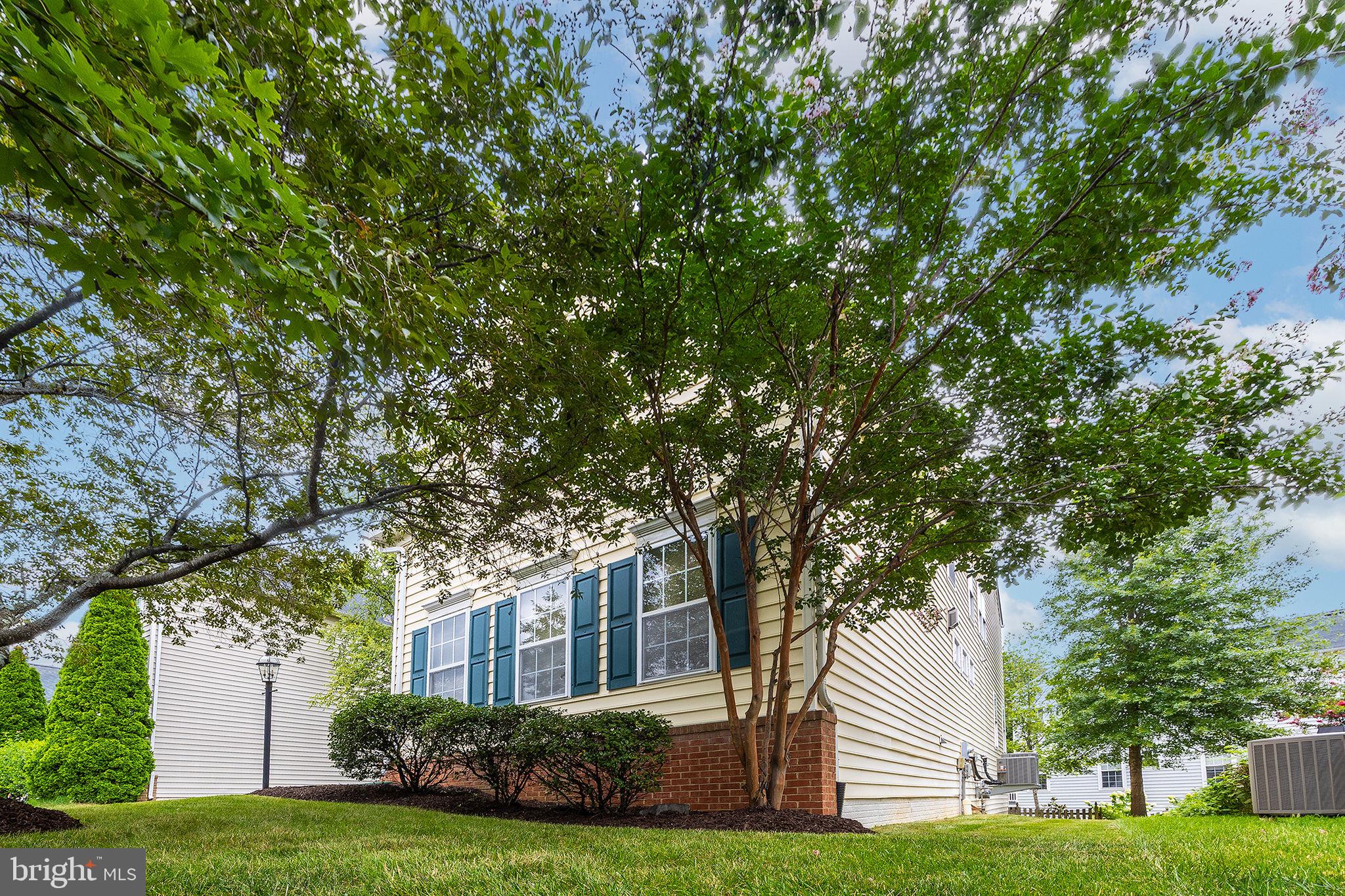 21934 Windover Drive Broadlands, VA 20148 - Photo 3 of 54 a view of house with yard