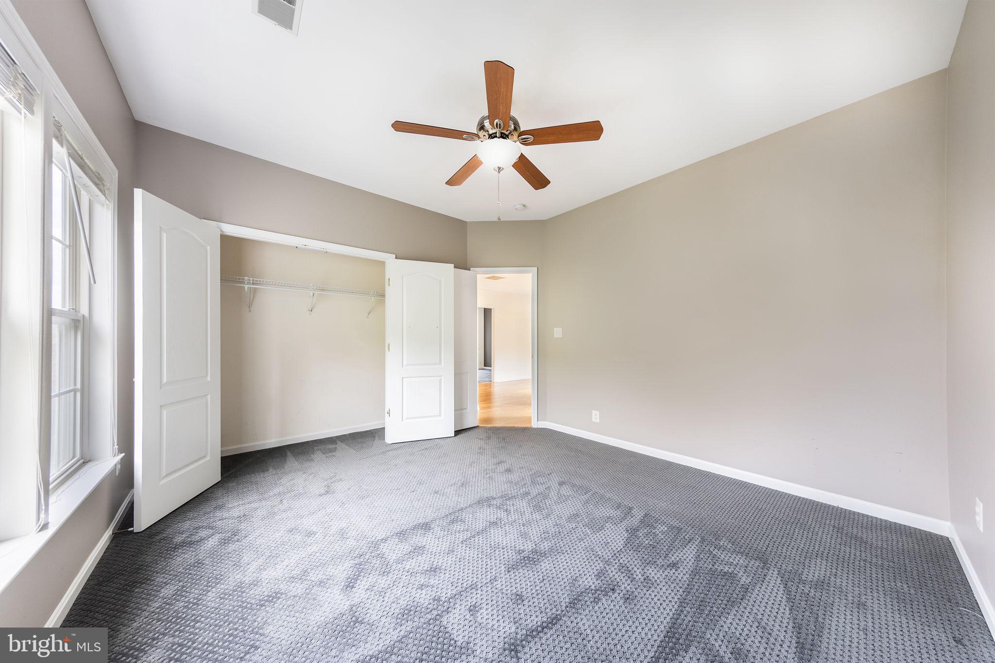 21934 Windover Drive Broadlands, VA 20148 - Photo 38 of 54 an empty room with windows and fan