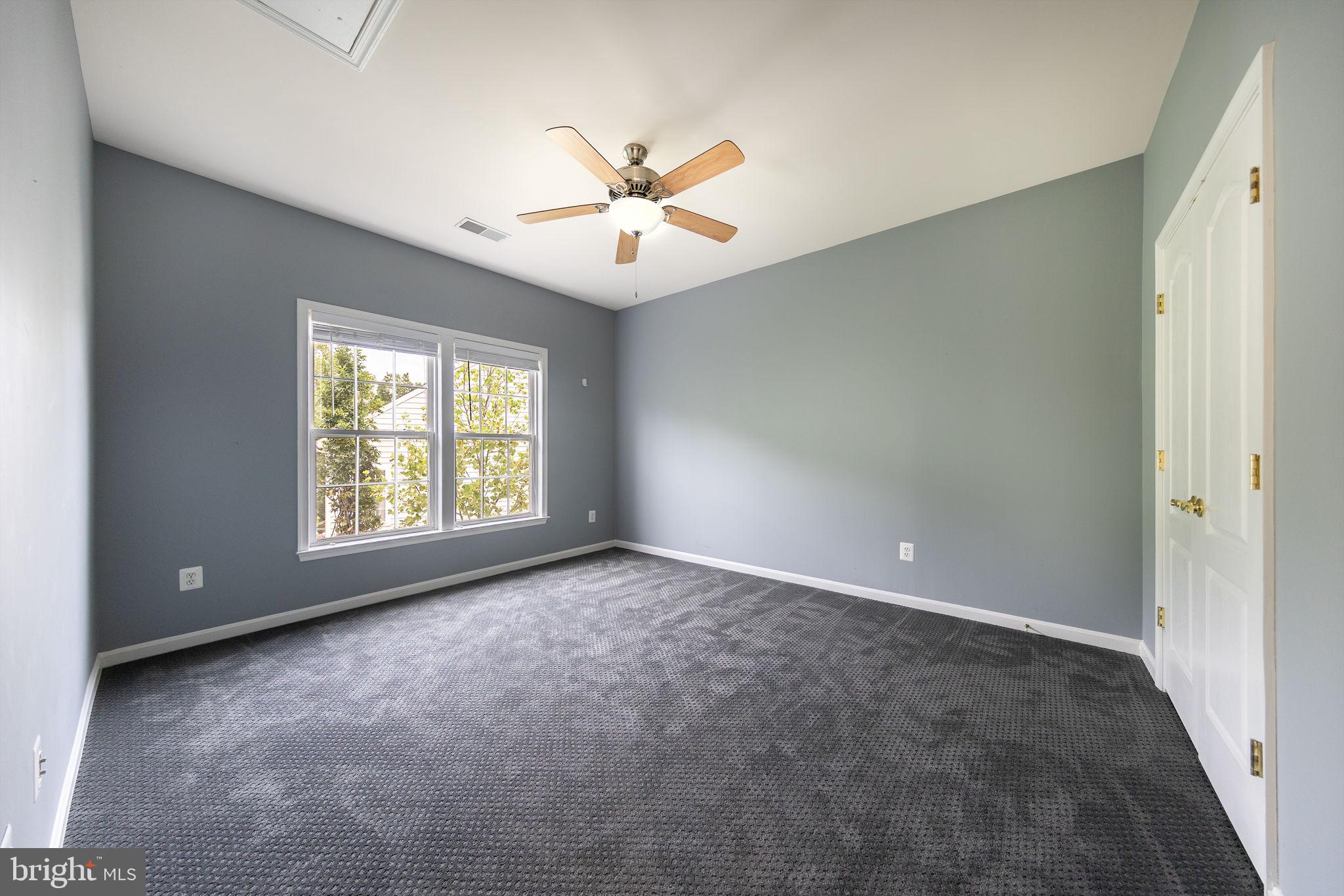 21934 Windover Drive Broadlands, VA 20148 - Photo 41 of 54 an empty room with windows and fan