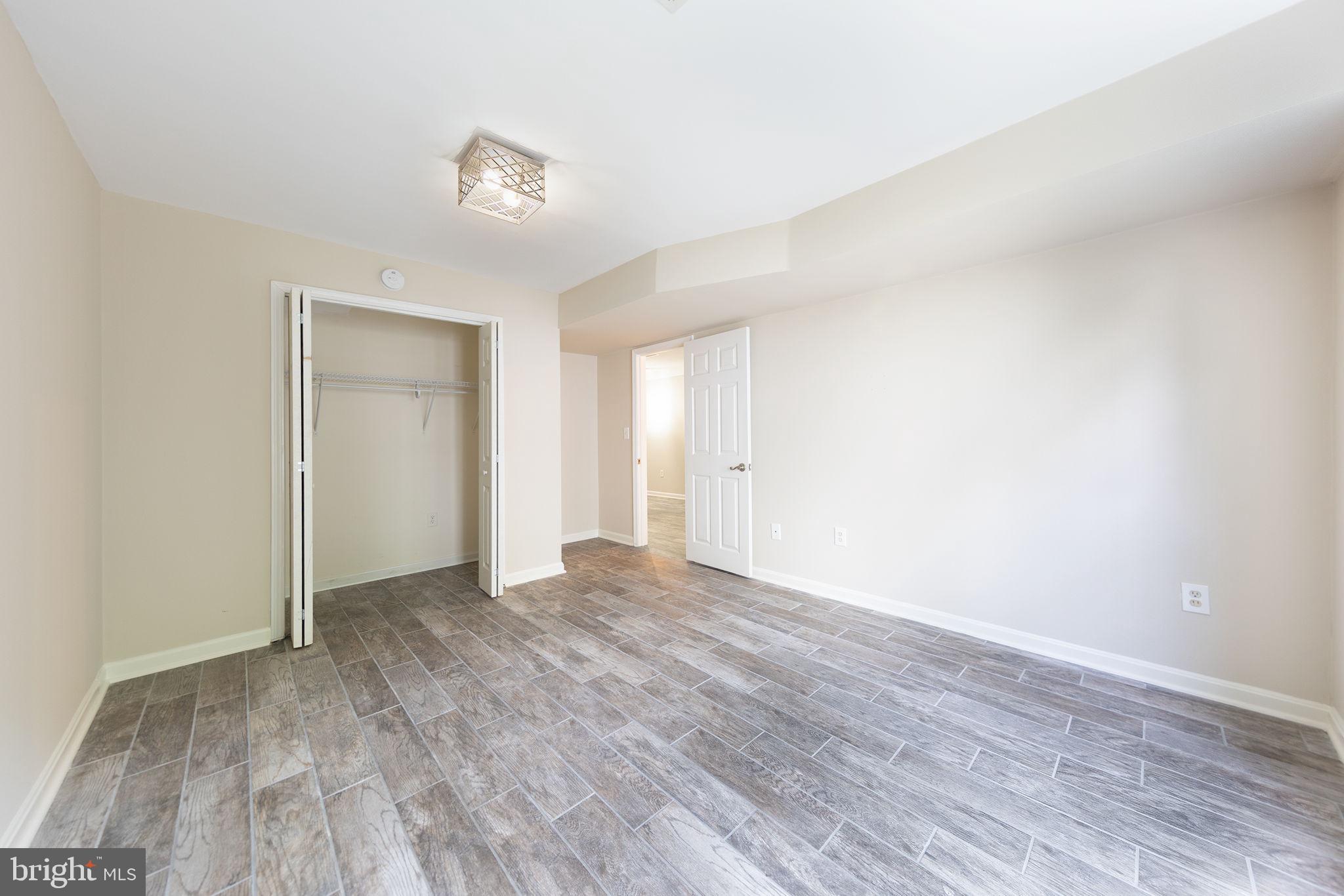 21934 Windover Drive Broadlands, VA 20148 - Photo 47 of 54 a view of an empty room and wooden floor