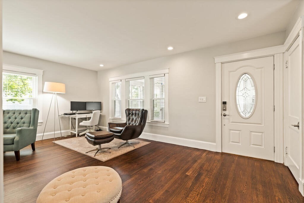 43 Guild Street Medford, MA 02155 - Photo 14 of 33 a workspace with wooden floor and windows