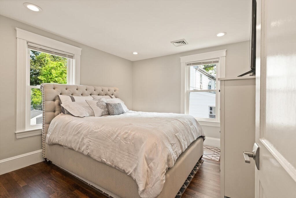 43 Guild Street Medford, MA 02155 - Photo 16 of 33 a spacious bedroom with a bed and a window