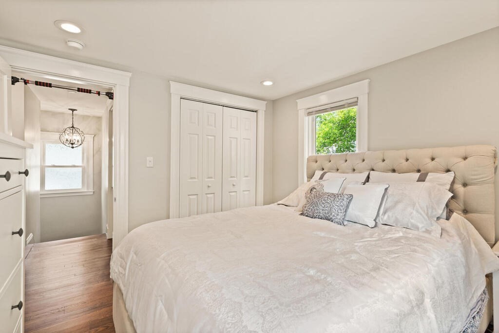 43 Guild Street Medford, MA 02155 - Photo 17 of 33 a bedroom with a large bed and a window