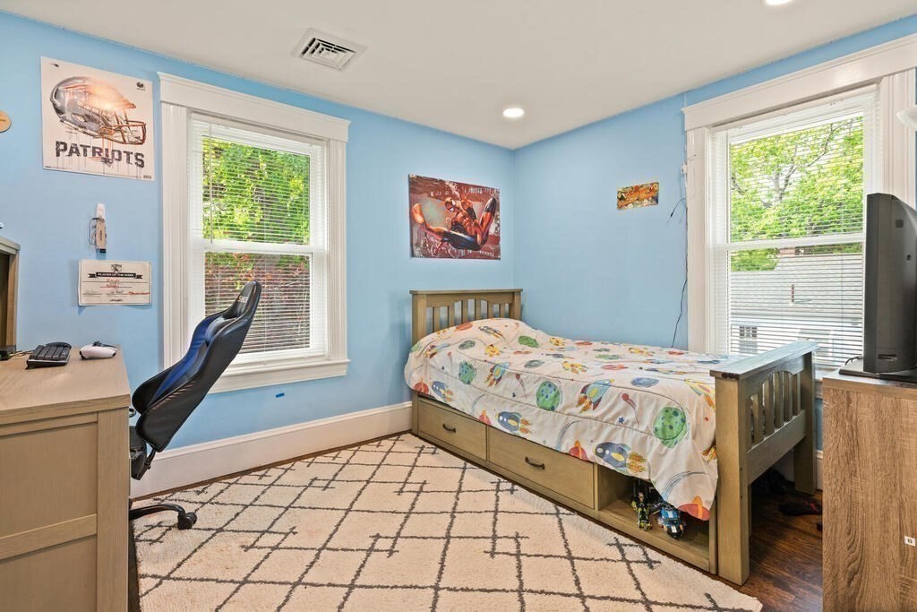43 Guild Street Medford, MA 02155 - Photo 19 of 33 a bedroom with a bed and a window