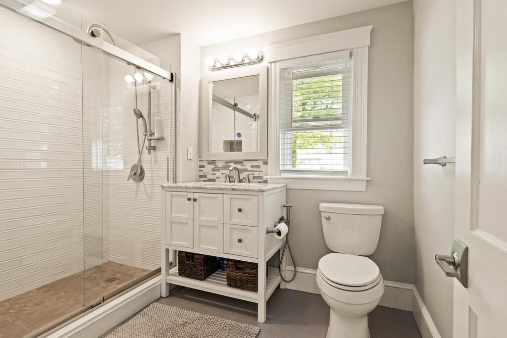 43 Guild Street Medford, MA 02155 - Photo 20 of 33 a bathroom with a sink a toilet and shower