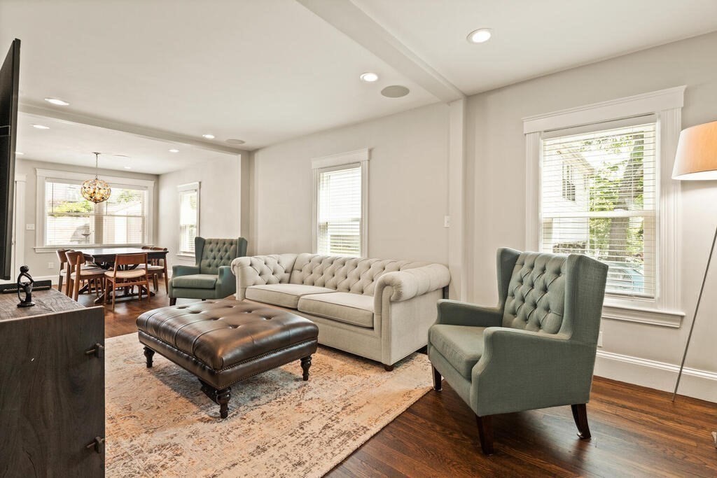 43 Guild Street Medford, MA 02155 - Photo 5 of 33 a living room with furniture wooden floor and a large window