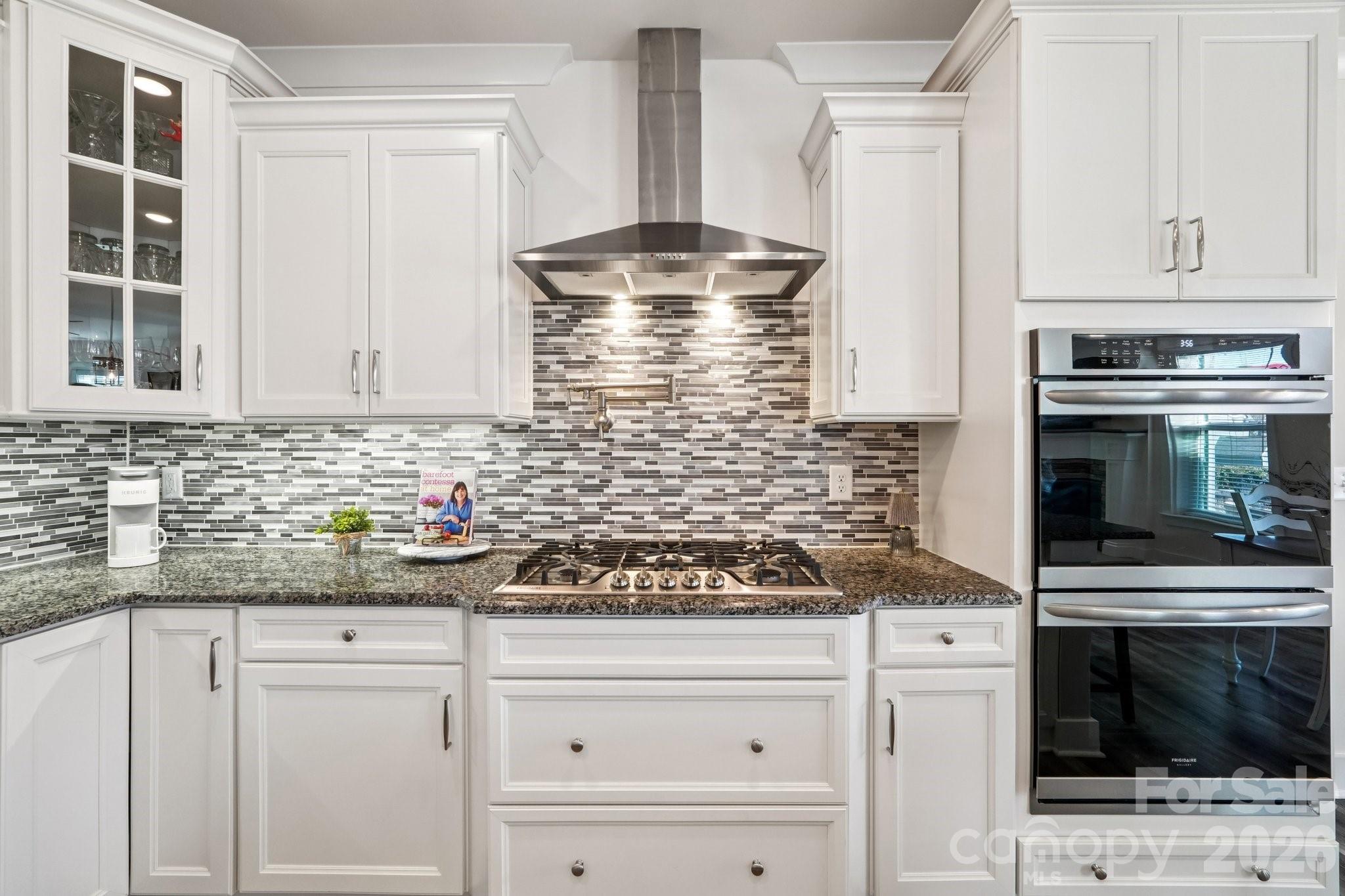 4093 Clapton Drive Lancaster, SC 29720 - Photo 15 of 48 a kitchen with white cabinets and appliances